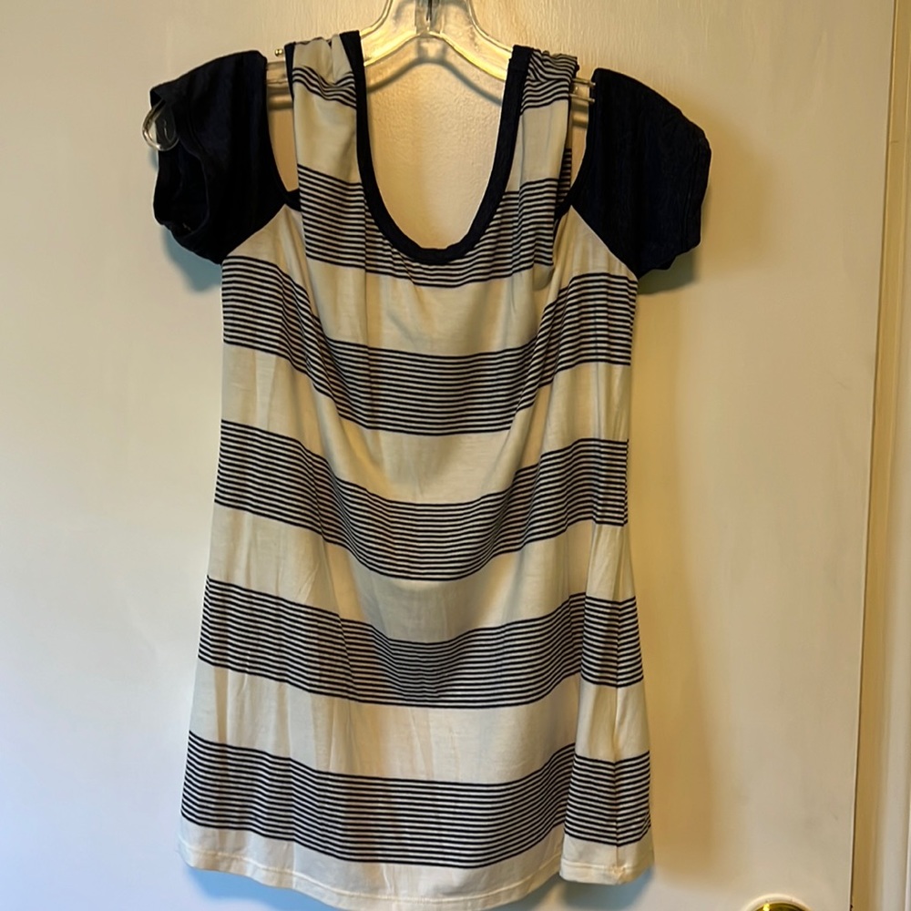 Cold shoulder, short sleeved, very soft, woman’s top. Never worn, no tags.
